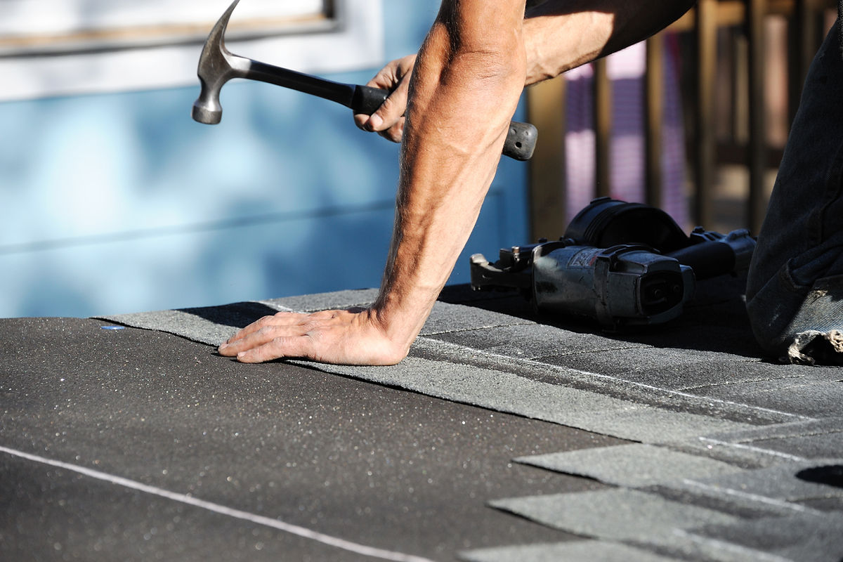 Roofing work scene during a flat roof installation by DSY Roofing & Building Contractors